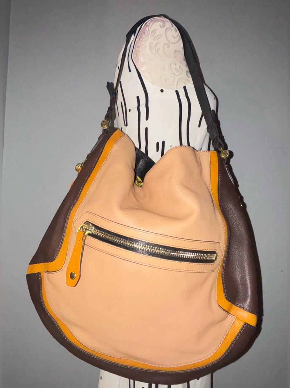Oryany Angelique Hobo bag featuring a slouchy silhouette and contrast trim.